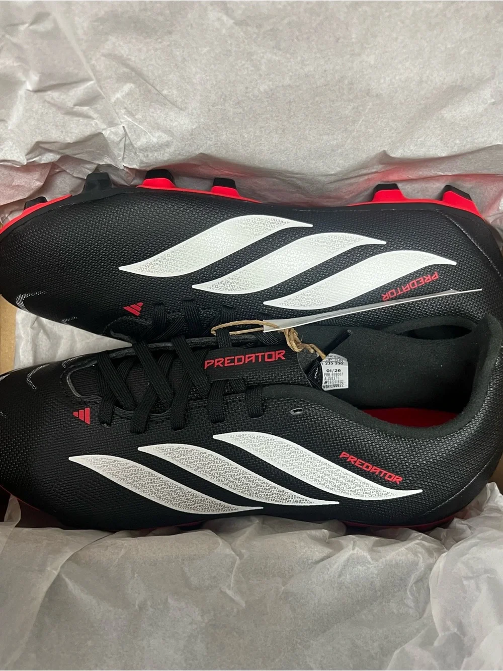 adidas Black Soccer Cleats with White Stripes and Red Accents